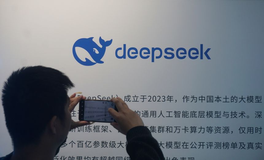 A citizen is watching a display board about DepSeek AI big model in a shopping mall in Hangzhou, Zhejiang Province, China on April 23, 2026.