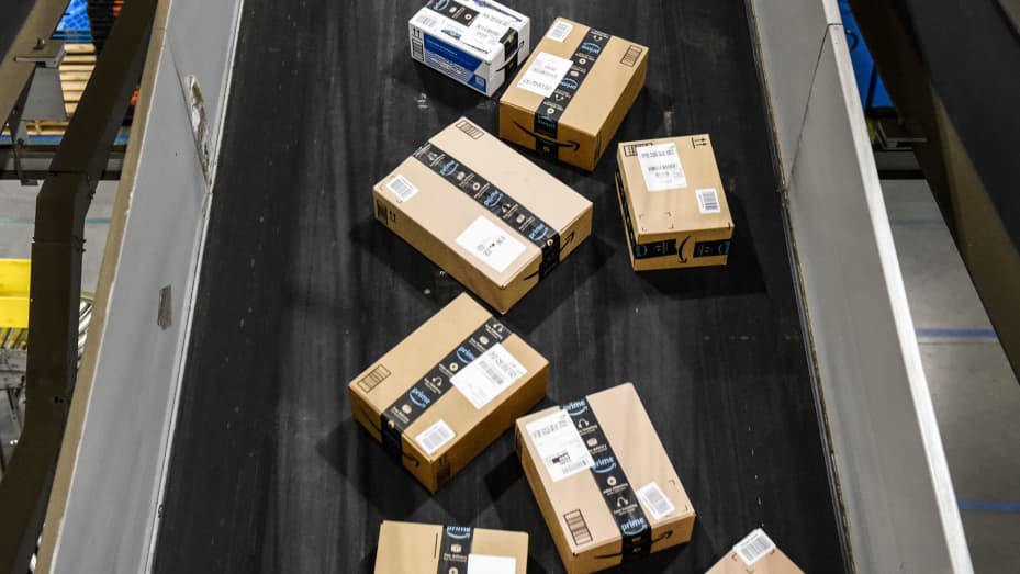 Packages move along a conveyor belt at an Amazon Fulfillment center on Cyber Monday in Robbinsville, New Jersey, on Monday, Nov. 28, 2022.